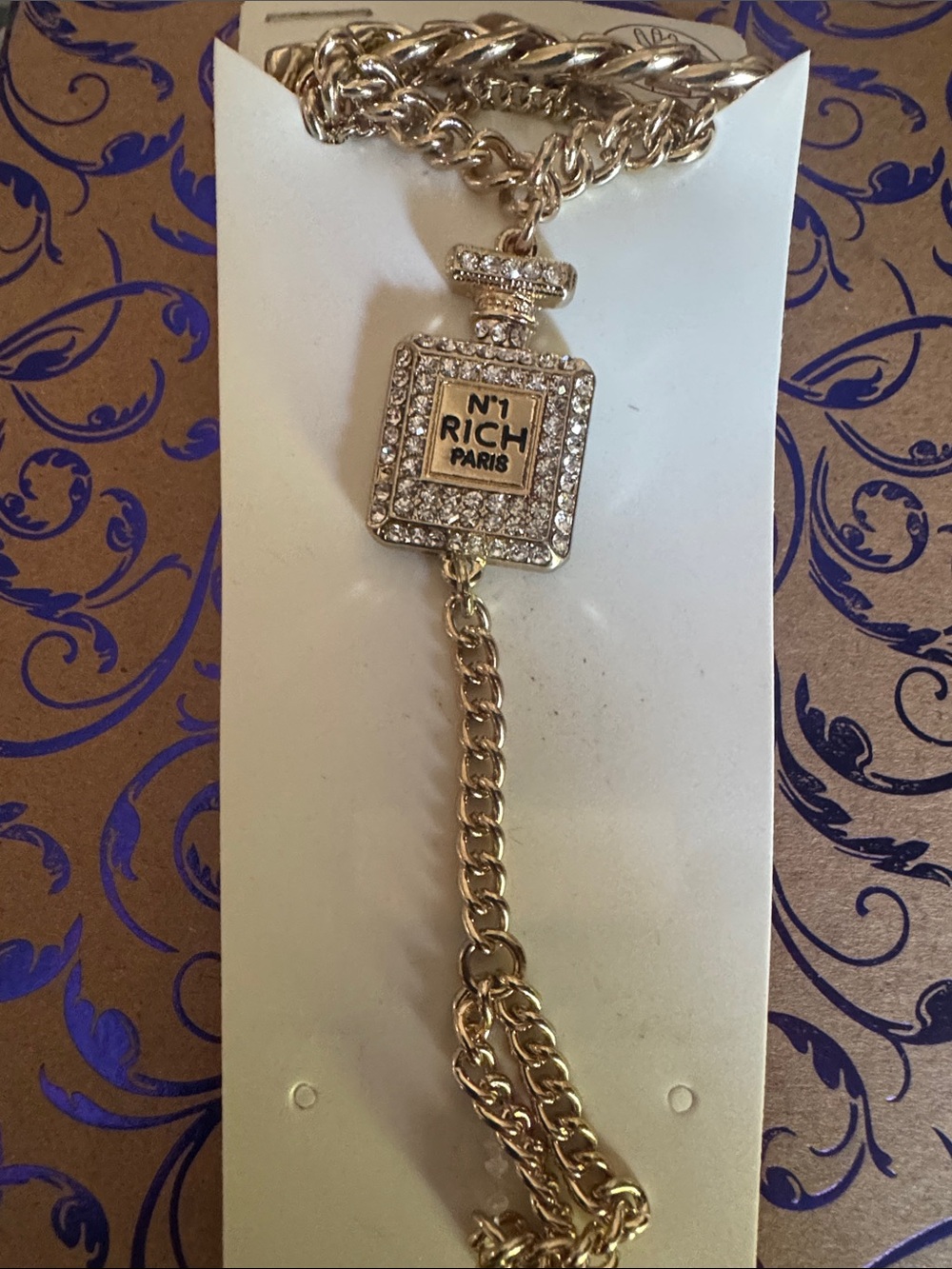 Hand Bracelet reads N1 RICH PARIS